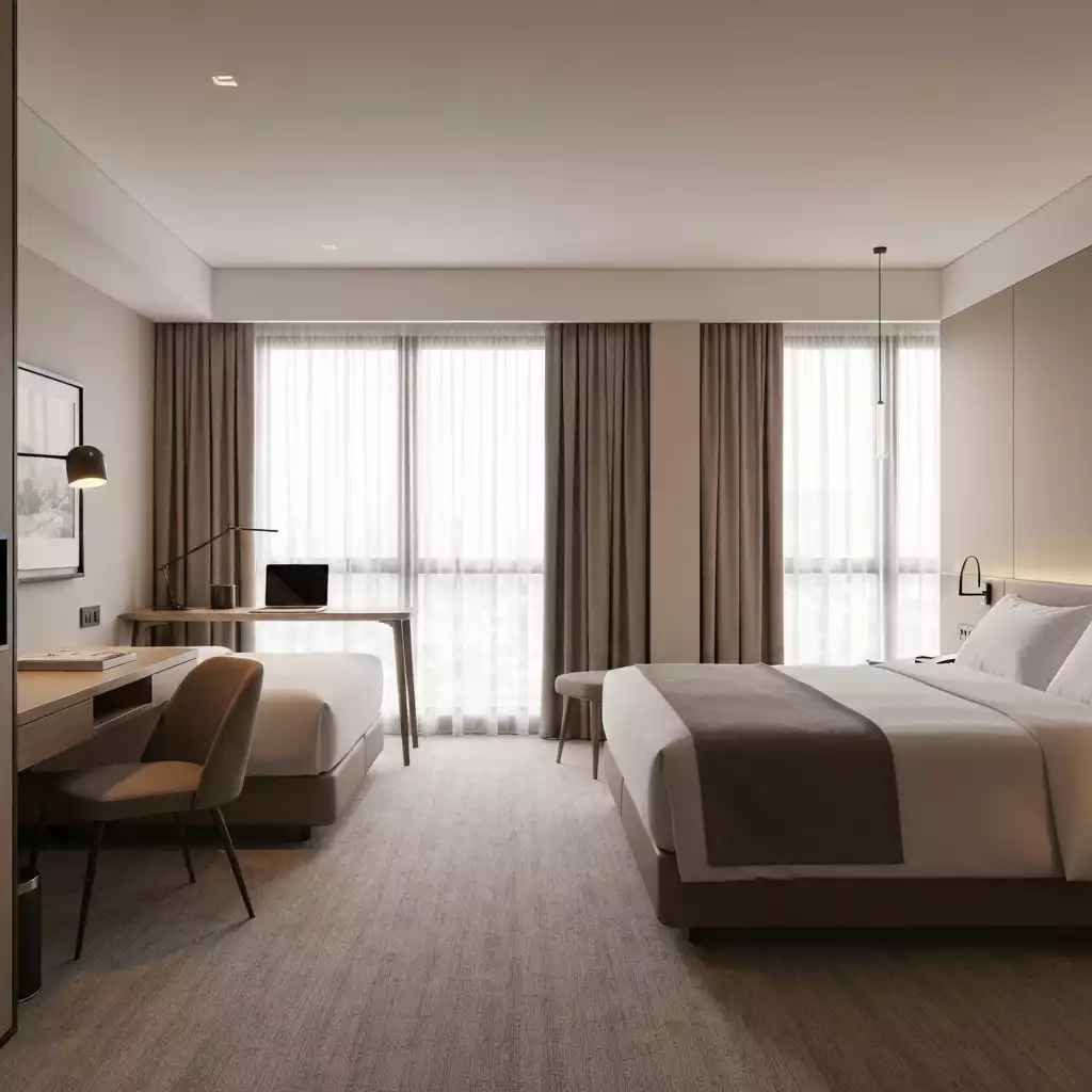 Modern hotel room with comfortable bed and dedicated workspace